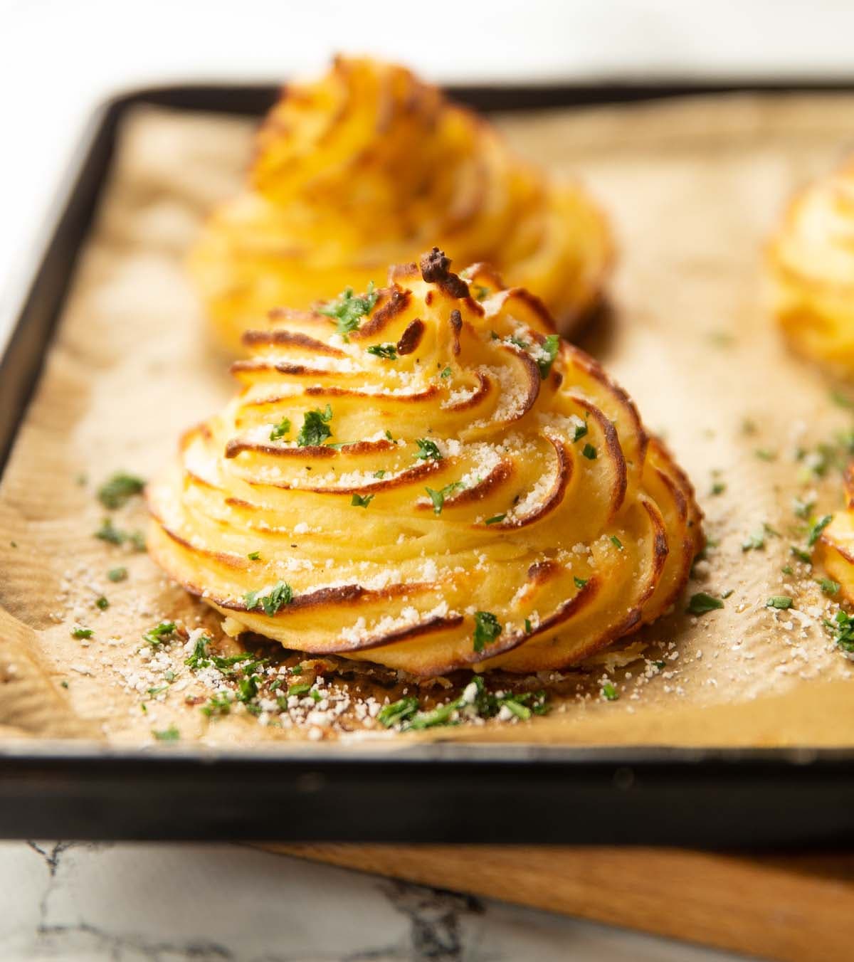 Garlic Parmesan Duchess Potatoes with Roasted Garlic